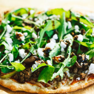 Sausage Mushroom Leek Pizza with Arugula and Fig Balsamic Reduction