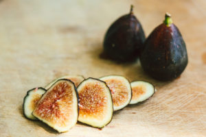 Fig, Bacon, Cashew Chive Cheese with Arugula and a Fig Balsamic Glaze