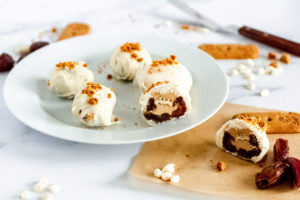 Vegan White Chocolate Covered Cookie Butter Cheesecake Stuffed Dates