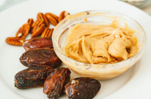 Vegan White Chocolate Covered Cookie Butter Cheesecake Stuffed Dates