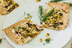 Pistachio, Rosemary, and Shallot Lavash Pizza with Balsamic Reduction