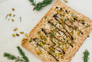 Pistachio, Rosemary, and Shallot Lavash Pizza with Balsamic Reduction
