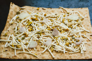 Pistachio, Rosemary, and Shallot Lavash Pizza with Balsamic Reduction