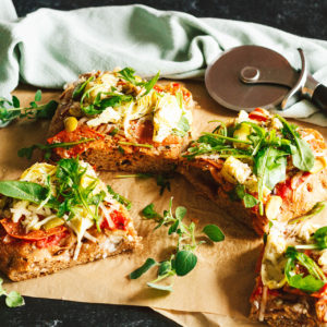 Salami, Artichoke, and Green Olive Pizza with Arugula on Focaccia