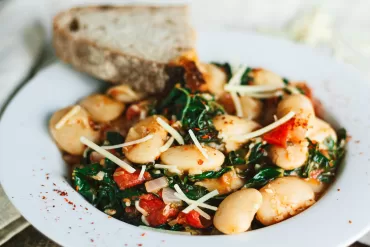 Saucy White Beans with Tomatoes, Greens, and Garlic